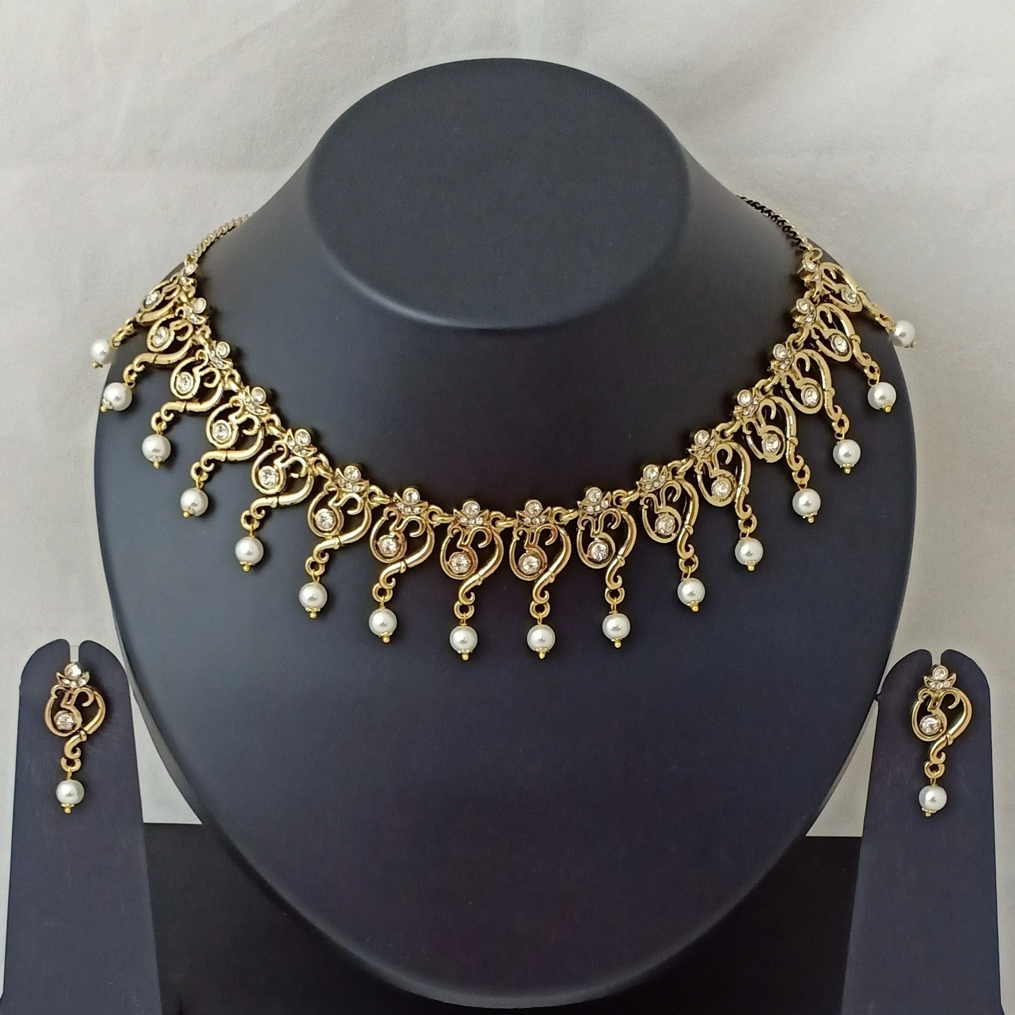 Estele Gold Plated Antique Spiritual Om Shaped Necklace Set with Austrian Crystals & Glowing Pearls for Women