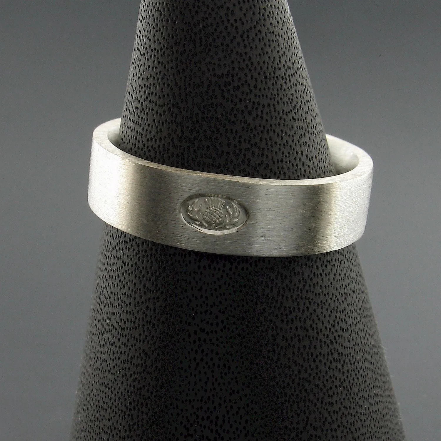 Silver wedding ring, Scottish flat medium brushed band.