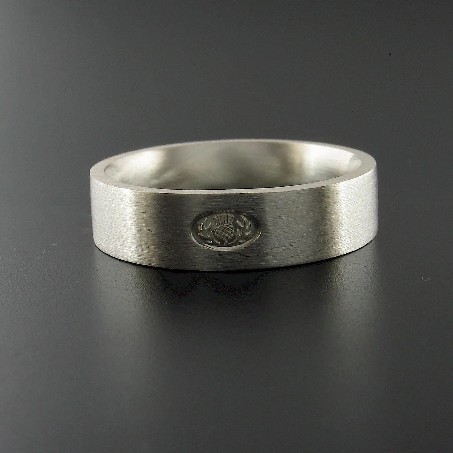 Silver wedding ring, Scottish flat medium brushed band.