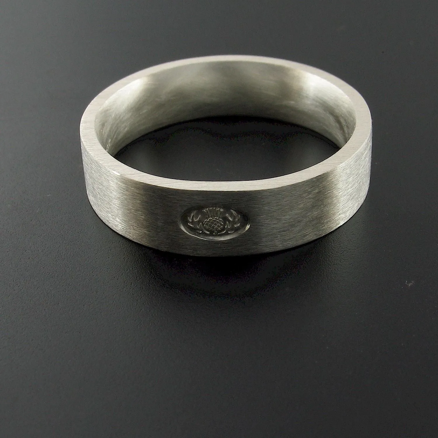 Silver wedding ring, Scottish flat medium brushed band.