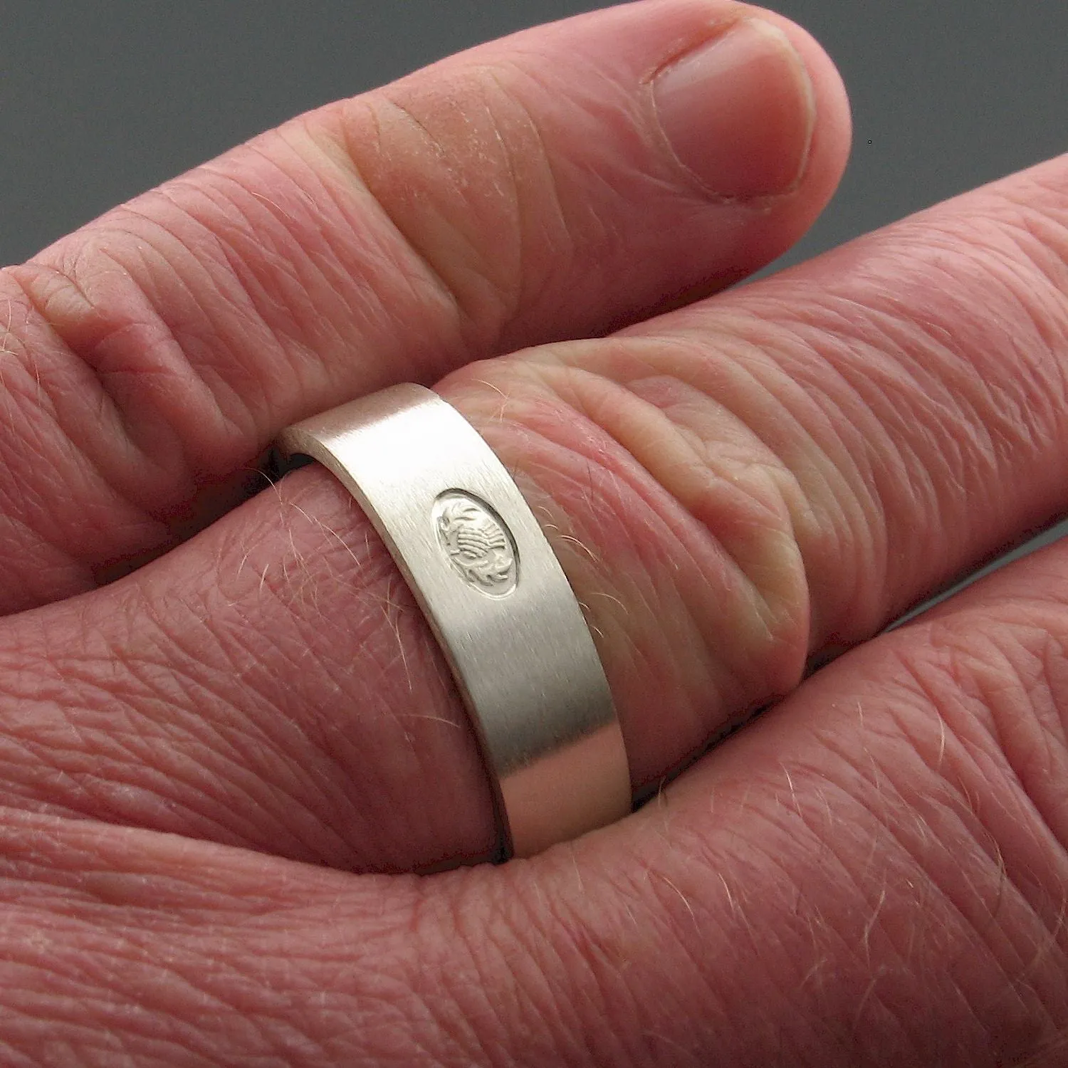 Silver wedding ring, Scottish flat medium brushed band.